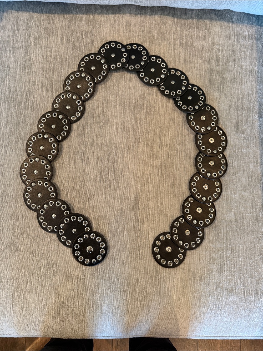 Black and silver belt. Size Lg but can be smaller using customized snaps.
